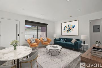 Los Angeles apartment for rent - A living room with a white table and chairs.