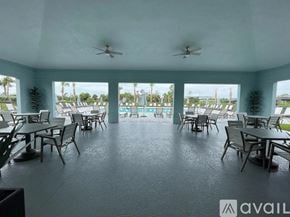 Port Charlotte house for rent - A spacious outdoor dining area with multiple tables and chairs.