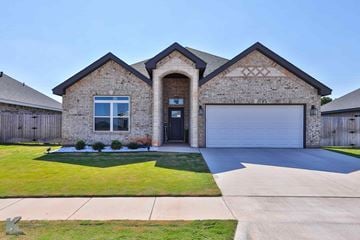 Abilene house for rent - A house with a brick facade and a large driveway.