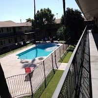 Phoenix apartment for rent - A black fence surrounds a small pool.