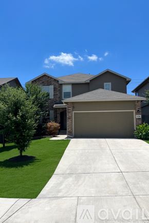 San Antonio house for rent - A blue car is parked in front of a house with a driveway.