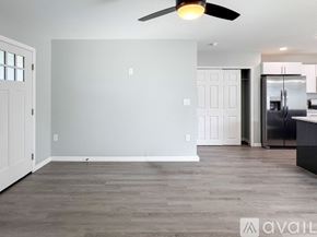Sebring house for rent - A bedroom with a bed, nightstand, and window.