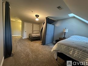 Hartland apartment for rent - A bedroom with a bed, dresser, and nightstand.