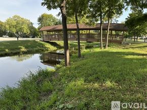 Hartland apartment for rent - A gazebo sits in the middle of a grassy area next to a body of water.