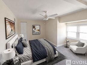 St. Louis house for rent - A small bathroom with a toilet and a cabinet.