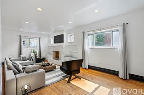 Pittsburgh house for rent - A laundry room with a washer and dryer and a bathtub.