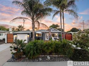 San Diego house for rent - A house with a front yard and palm trees.