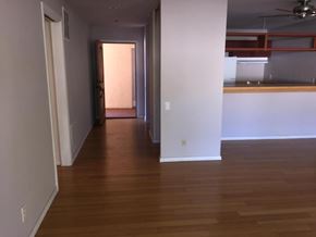 Santa Barbara house for rent - A room with wooden floors and white walls.