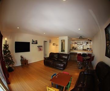 Santa Barbara house for rent - A living room with a Christmas tree and a bar area.