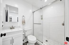 Los Angeles apartment for rent - A white bathroom with a toilet, sink, and shower.