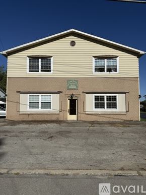 Cambridge Springs apartment for rent - A house with a black SUV parked in front.