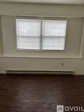 Cambridge Springs apartment for rent - A room with a window and wooden flooring.