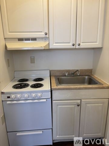Cambridge Springs apartment for rent - A white oven and sink in a kitchen.