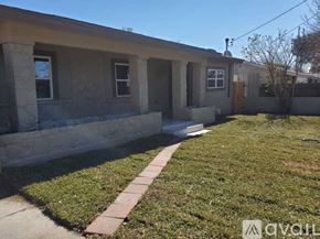 San Antonio apartment for rent - A small house with a brown door and a brown walkway in front.