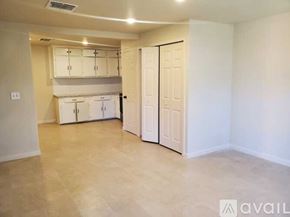 San Antonio apartment for rent - A room with a white door and a white cabinet above it.