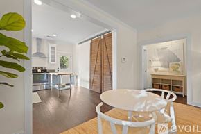 Savannah house for rent - A modern kitchen with a dining table and chairs in the foreground.