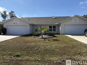 Punta Gorda apartment for rent - A spacious room with arched doorways and a ceiling fan.