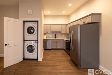 Stroudsburg apartment for rent - A modern kitchen with a washer and dryer built into the cabinetry.