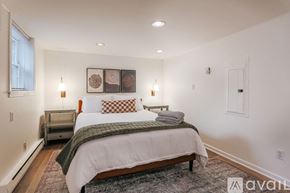 Charlottesville apartment for rent - A bedroom with a large bed and a window.