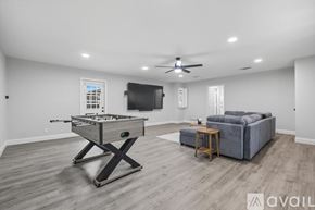Flower Mound house for rent - A spacious room with a pool table and a couch.