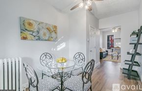 Washington townhouse for rent - A dining room with a glass table and chairs.