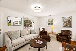 Savannah house for rent - A living room with a couch, chairs, and a coffee table.
