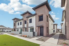 Glendale apartment for rent - A row of houses with a green lawn in front.