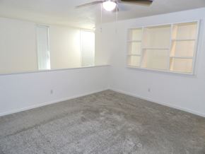 Dallas apartment for rent - A room with a carpeted floor and a window with blinds.