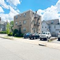 Arlington apartment for rent - A street with cars and buildings on both sides.