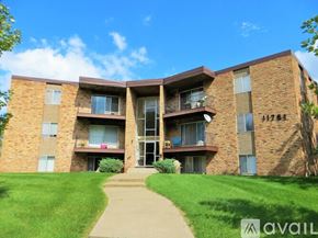 Coon Rapids apartment for rent - A brick apartment building with the number 11781 on the side.
