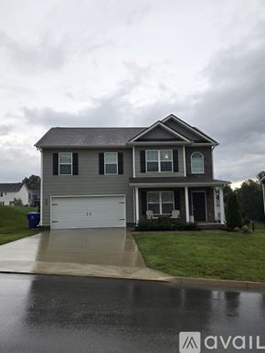 Knoxville house for rent - A two-story house with a white garage door.