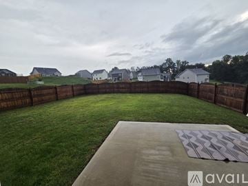 Knoxville house for rent - A kitchen with wooden cabinets and granite countertops.