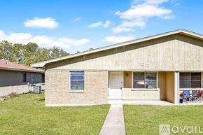 Belton house for rent - A house with a beige exterior and a white door is for sale.