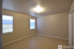 Belton house for rent - A bathroom with a toilet, sink, and shower.