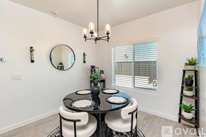 Lake Havasu City house for rent - A dining room with a round table and chairs.
