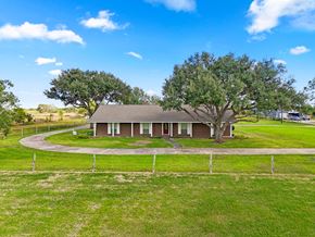 Bay City house for rent - A house with a large tree in front of it.