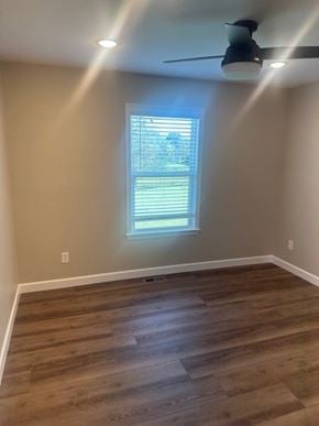 Madisonville house for rent - A room with a ceiling fan and a window with blinds.