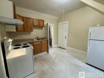Willmar apartment for rent - A kitchen with a white stove and a white refrigerator.
