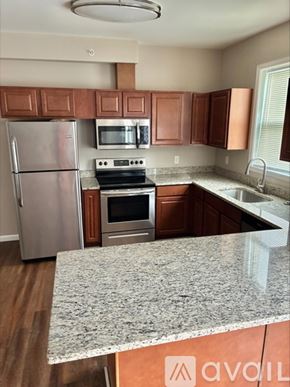 Cincinnati apartment for rent - A kitchen with a granite countertop and stainless steel appliances.