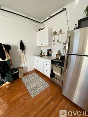 Boston apartment for rent - A kitchen with a refrigerator, oven, and sink.