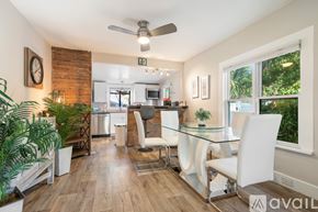 Gulfport house for rent - A kitchen with a bar counter and two chairs.