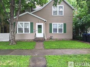 Mankato apartment for rent - A house with a green door and green shutters.