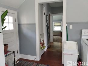 Mankato apartment for rent - A room with a white door and a white washing machine.
