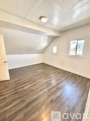 Los Angeles house for rent - A room with wooden flooring and a window.
