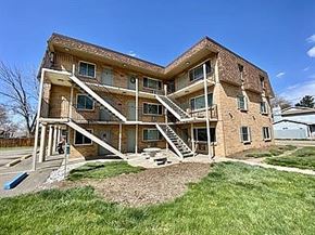 Englewood apartment for rent - A large two-story house with a balcony on the second floor.