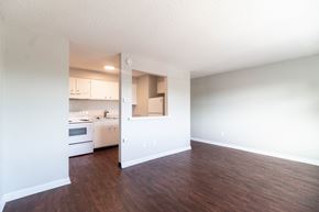 Englewood apartment for rent - A kitchen with white cabinets and a wooden floor.