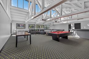 Merrillville apartment for rent - A room with a pool table and a billiard table.