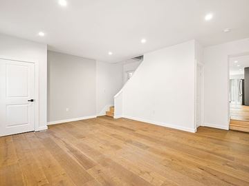 Philadelphia house for rent - A room with wooden floors and white walls.