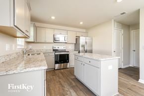 Lexington house for rent - A kitchen with a marble countertop and stainless steel appliances.