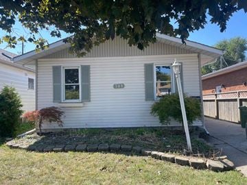 Windsor house for rent - A small white house with a number 382 on the front.